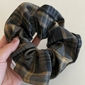 Classic grey and yellow tartan plaid scrunchie with a small decorative brand label - Black Khaki Plaid Scrunchie