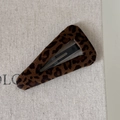 Detailed view of the leopard print plush texture and black metal clip of the BB hair pin - Dark Leopard Flocked Triangle