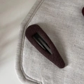 Close-up of retro brown ribbed fabric hair clip with a durable black metal BB grip - Hollow Water Drop Hair Clip / Khaki