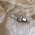 Elegant bow hair clip with silver alloy, white enamel, and a sparkling crystal center - Silver Wave Clip with Large Rhinestone Bow