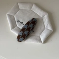 Close-up of brown and blue houndstooth weave fabric BB hair clip on a quilted mat - Blue Coffee Rhombus Oval Clip