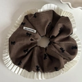 Brown leopard print scrunchie with white ruffled edges and black bow details - Khaki Hair Tie with Black Bowknots