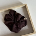 Vintage dark brown knitted scrunchie with Hand Made label on minimalist wooden tray - Brown Striped