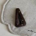 Detailed view of dark brown wool fabric BB clip with white polka dots on linen fabric - Coffee Triangle Polka Dot Hair Clip