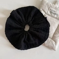 Detail shot of the black double-layered knit scrunchie texture and soft pleated fabric - Black