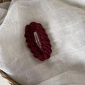 Deep red handmade knitted oval hair clip with wave edge on rustic white background - Wine Red Wool Hair Clip