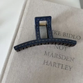 Close-up of a blue denim texture hair claw clip with yellow contrast stitching details - Denim Acrylic Long Bar Claw Clip