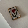 Close-up of handmade embroidered red tulip hair clip with yellow stitched border - Red Tulip Square Style