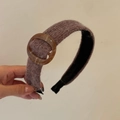 Brown knit padded headband with amber resin ring for a high cranial top look - Khaki