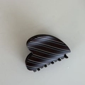 Macro shot of striped heart-shaped hair claw clip with blue and white pattern - Heart Shaped Style (D191)