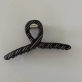 Detailed top view of a brown striped hair claw clip with cross handle and metal spring - Large Cross Style (D191)