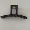 Close-up of brown striped claw clip featuring a square design and golden metal spring - Rectangular Bar Style (D191)