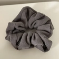 Close-up of grey wool knit scrunchie with waffle texture and elastic fabric detail - Gray Stripe Scrunchie