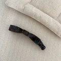 Detail showing high-gloss dark tortoiseshell pattern on curved acetate banana hair clip - Tortoise Blue Texture Bow Banana Clip