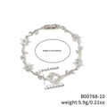 Silbernes Kleeblatt Armband mit Zirkonia, Blumenranken und weißem Perlmutt Inlay - Weiße Blume Silberner Zweig (B00768-10)