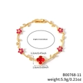 Goldenes Armband mit roten Blütenanhängern und Kleeblatt-Anhänger mit Blattakzenten - Rote Blume Goldener Zweig (B00768-11)