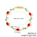 Rosendornen-Armband in Gold mit roten Steinen und grünen Blättern, 18 cm lang - Gold + Rot/Grün (B00764-13)