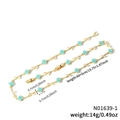 Exquisite gold clover necklace with green gemstone charms and sparkling leaf accents - Blue Gemstone Gold Chain (N01639-1)