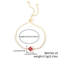 Bracciale a quadrifoglio dorato regolabile con pietre rosso rubino e zirconi cubici - Trifoglio Oro con Forma a Goccia Rossa (B00766-19)