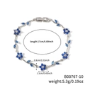 Pulsera de plata con flores y hojas de circón azul, longitud 17cm y peso de 5,3g - Estilo de Flor Azul Claro y Estrás Transparente en Tono Plateado (B00767-10)
