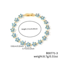 Goldenes Gliederkettenarmband mit blauen Blumenanhängern und detaillierten Größenangaben - Himmelblaue Blume Goldene Basis (B00771-3)