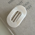 Detail view of cream marble hair claw clip with smooth resin texture and steady teeth - 2# White Oval Claw