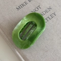 Detail view of the high-quality marble-textured green hair claw clip with internal teeth - 3# Green Oval Claw