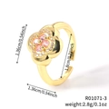 Anillo ajustable de flor dorada con circonitas rosas en forma de corazón - Flor de Circonia Rosa Dorada (R01071-3)