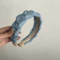Detail view of the light blue braided denim headband showing fabric texture and sturdy ends - Sky Blue Denim