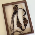 Detailed view of bohemian wood bead waist chain with coconut shell flowers and long tassels - 13# (Brown Rope Coconut Flower)