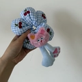 Detailed close-up of a blue checkered plush hair tie with cherry embroidery and pink cat doll - 2# Pink Cat Flower Scrunchie