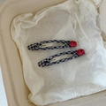Blue plaid fabric BB hair clips with red rhinestone accents on white textured paper - Black Plaid Red Crystal