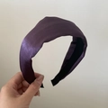 Detail view of a wide satin headband in deep purple with a non-slip inner lining - Bright Purple