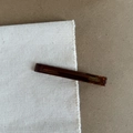 Close-up of amber translucent hair clip featuring golden FRANCE Handmade lettering detail - Amber Pattern