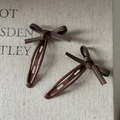 Detail view of retro brown plaid bow hair clips with white stitching on snap metal base - Brown Stitched Bow