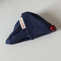 Handmade navy denim triangle hair clip with a red button and white brand label - Solid Denim Triangle Clip