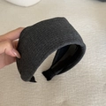 Close-up of the dark grey ribbed knit texture and wide design of this stylish headband - Dark Gray Striped Headband