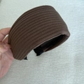 Detail view of the brown knitted ribbed wide headband with non-slip black inner lining - Brown Striped Headband