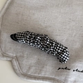 Detail of black and white gingham fabric texture on a pleated banana hair clip - Black & White Plaid Banana Clip