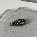 Detail of tear-drop hair clip with black and white plaid fabric and blue heart charms - Gray Plaid Trapezoid Heart