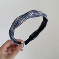 Close-up of blue and red plaid crossover headband with anti-slip teeth for secure styling - Blue Red White Striped Criss-Cross Style