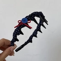 Detail of blue polka dot headband with red bow, buttons and inner teeth for hair styling - Non-Slip Toothed Headband / Blue White Polka Dot Toothed Headband