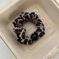 Leopard print fabric scrunchie with a large black resin bead and elastic design - Beaded Leopard Print Hair Tie (#6)