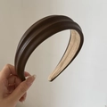 Detailed macro view of dark brown faux leather headband with premium lychee grain texture - 5# Brown PU Headband