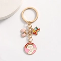 Golden keychain with pink bow, rainbow LOVE letters and Don't Give Up charm on white background - Bowknot Style
