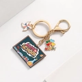 Detail of Back to School gold keychain featuring a blackboard and colorful balloon charms - Blackboard Style
