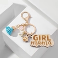 Llavero de madera GIRL mama con borla azul y colgante dorado sobre soporte de piedra blanca - Azul