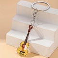 Portachiavi creativo a forma di chitarra gialla in acrilico con motivo musicale per auto - Giallo