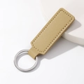 Minimalist beige PU leather keychain with litchi texture and silver metal ring - Rectangle / Khaki
