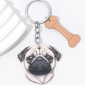 Detail of 3D pug dog keychain with bone charm and polished metal chain attachment - Pug Style (Style One)